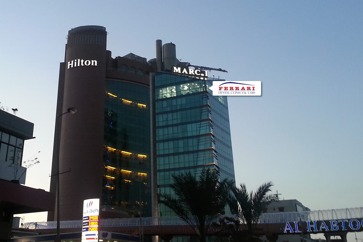 Ferrari Dental Clinic MarCI building Horch Tabet Beirut at night — Smile Infinity® Lebanon